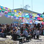People gather in Ninilchik, Alaska, on Friday, Aug. 5, 2022, for Salmonfest, an annual event that raises awareness about salmon-related causes. (Ashlyn OHara/Peninsula Clarion)
