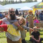 People gather in Ninilchik, Alaska on Friday, Aug. 5, 2022 for Salmonfest, an annual event that raises awareness about salmon-related causes. (Camille Botello/Peninsula Clarion)