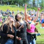 People gather in Ninilchik, Alaska on Friday, August 5, 2022 for Salmonfest, an annual event that raises awareness about salmon-related causes. (Camille Botello/Peninsula Clarion)