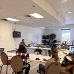 Aaron Surma, the executive director for National Alliance on Mental Illness Juneau and the Juneau Suicide Prevention Coalition, leads a safety plan workshop Tuesday night hosted by NAMI and the Juneau Suicide Prevention Coalition. The workshop was a collaborative brainstorming session with Juneau residents about how to create a safety plan that people can use to help someone who is experiencing a mental health or suicide crisis. (Clarise Larson / Juneau Empire)