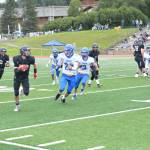 Mariner Jake Tappan sprints down the right flank on Saturday, Aug. 13, 2022, at Homer High School in Homer, Alaska. (Photo by Charlie Menke/ Homer News)