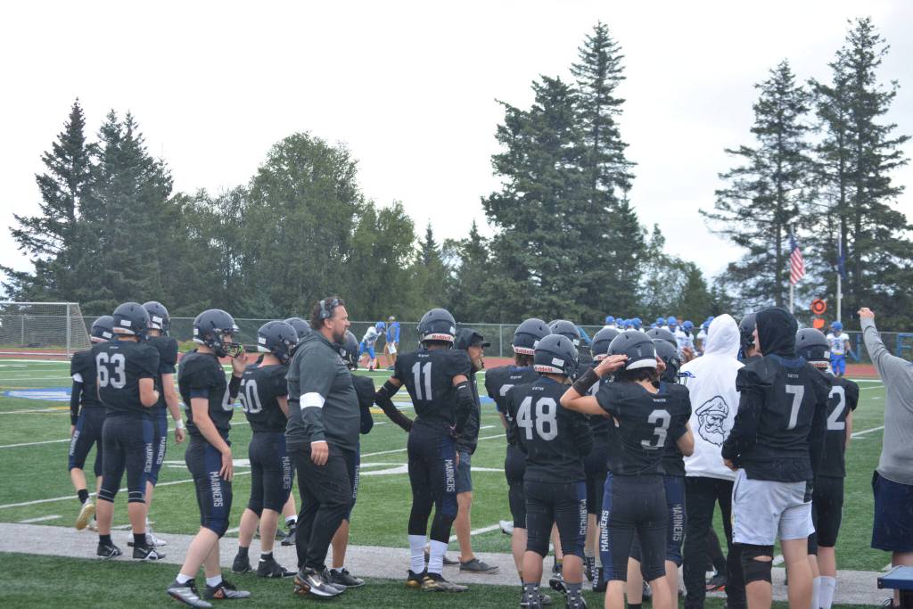 Mariners wait in anticipation for the first kick-off of the season on Saturday, Aug. 13, 2022, at Homer High School in Homer, Alaska. (Photo by Charlie Menke/ Homer News)
