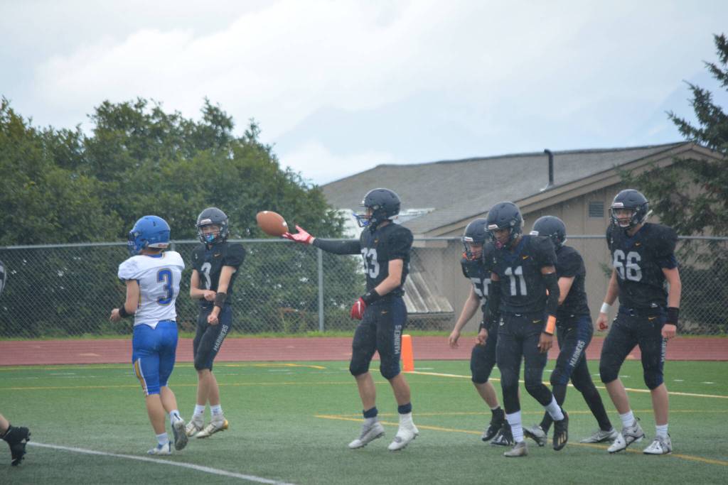 The Mariners celebrate after a crucial early score on Saturday, Aug. 13, 2022, at Homer High School in Homer, Alaska. (Photo by Charlie Menke/ Homer News)