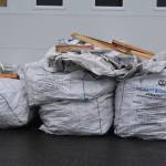 Full recycling super sacks ready to be delivered to Seward sit behind the Cook Inletkeeper Community Action Studio in Soldotna, Alaska, on Aug. 11, 2022. (Jake Dye/Peninsula Clarion)