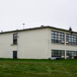 The small Homer Educational and Recreational Complex, or HERC, building is seen here on Oct. 2, 2021, in Homer, Alaska. Known as HERC 2, the former school building had been used as a shop by the Public Works Department, but staff relocated into HERC 1, the larger building, after cracks appeared in the walls and city officials had concerns about the building collapsing during an earthquake. (Photo by Michael Armstrong/Homer News)
