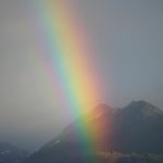 A rainbow shines over Kachemak Bay on Saturday, Aug. 20, 2022, in Homer, Alaska. (Photo by Michael Armstrong/Homer News)