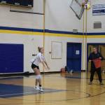 Junior Goldie Hill serves at Homer High School Alice Witte Gym on Wednesday, Aug. 24, 2022. (Photo by Charlie Menke/ Homer News)