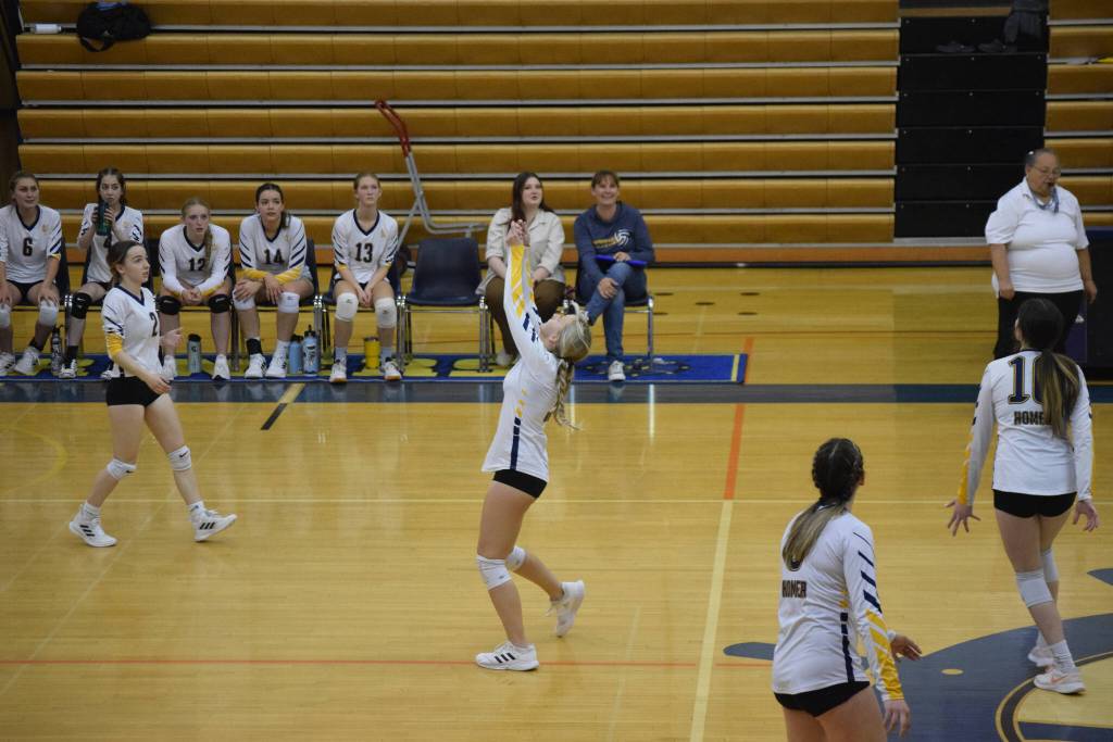 Isabel Dye with an important dig at Homer High School Alice Witte Gym on Wednesday, Aug. 24, 2022. (Photo by Charlie Menke/ Homer News)