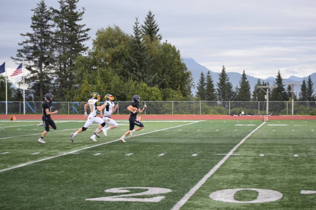 Jonah Martin sprints down the field on Friday, Aug. 26 at Homer High School Field in Homer, Alaska. (Photo by Charlie Menke/Homer News)