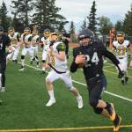 Preston Stanislaw attempts a touchdown rush on Friday, Aug. 26 at Homer High School Field in Homer, Alaska. (Photo by Charlie Menke/Homer News)