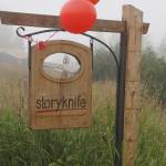 Fog rolls in over the sign for the Storyknife Writers Retreat at an open house on Monday, Aug. 29, 2022, near Homer, Alaska. (Photo by Michael Armstrong/Homer News)