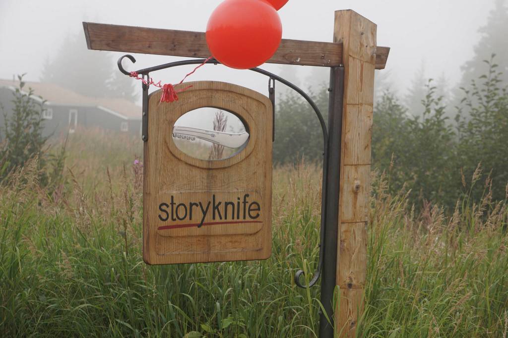 Fog rolls in over the sign for the Storyknife Writers Retreat at an open house on Monday, Aug. 29, 2022, near Homer, Alaska. (Photo by Michael Armstrong/Homer News)