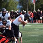 Senior Carter Tennison breaks through Kardinal defenses with assistance from fellow senior Eli Gordon on Saturday, Sep. 3, at the Homer High School Field in Homer, Alaska. (Photo by Charlie Menke/ Homer News)