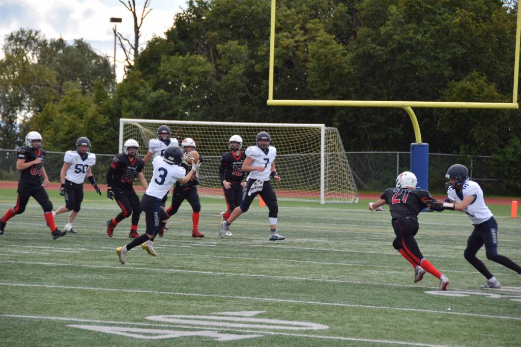 Jonah Martin catching the football during an impressive performance on Saturday, Sep. 3, at the Homer High School Field in Homer, Alaska. (Photo by Charlie Menke/ Homer News)