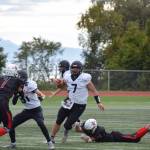 Tennison evades a diving tackle on Saturday, Sep. 3, at the Homer High School Field in Homer, Alaska. (Photo by Charlie Menke/ Homer News)
