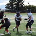 Senior Russel Nyvall jukes out a Kenai defender on Saturday, Sep. 3, at the Homer High School Field in Homer, Alaska. (Photo by Charlie Menke/ Homer News)