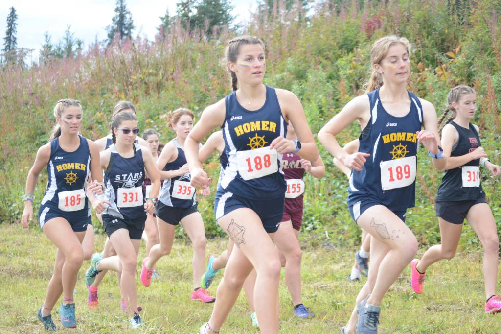 The girls cross-country runners take off at the start of the Homer Invite on Friday, Sept. 2, 2022, at the Lookout Mountain Trails near Homer, Alaska. (Photo by Michael Armstrong/Homer News)