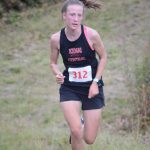 Jayna Boonstra of Kenai Central comes down the last hill to win the Homer Invite on Friday, Sept. 2, 2022, at the Lookout Mountain Trails near Homer, Alaska. (Photo by Michael Armstrong/Homer News)
