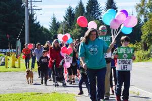 People with Walk for Life march up Bartlett Street to the Water's Edge crisis pregnancy clinic on Monday, Sept. 5, 2022, in Homer, Alaska. About 140 people walked from the Assembly of God Church and Glacier View Baptist Church on East End Road along Pioneer Avenue and up Bartlett Street to show their support for pro-life efforts and opposition to abortion. (Photo by Michael Armstrong/Homer News)