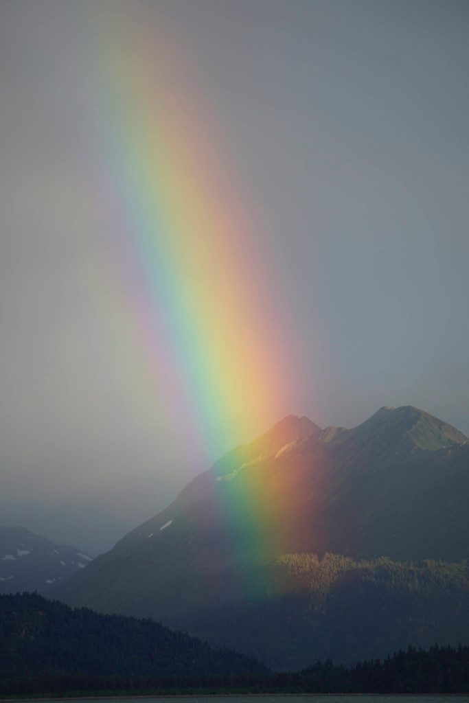A rainbow shines over Kachemak Bay on Saturday, Aug. 20, 2022, in Homer, Alaska. (Photo by Michael Armstrong/Homer News)