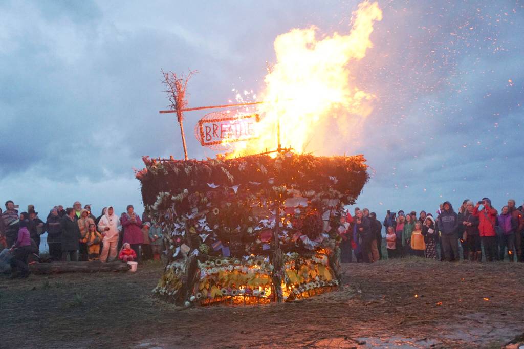As about 200 people watch, the 19th annual Burning Basket, Breathe, catches fire on Sunday, Sept. 11, 2022, at Mariner Park on the Homer Spit in Homer, Alaska. (Photo by Michael Armstrong/Homer News)