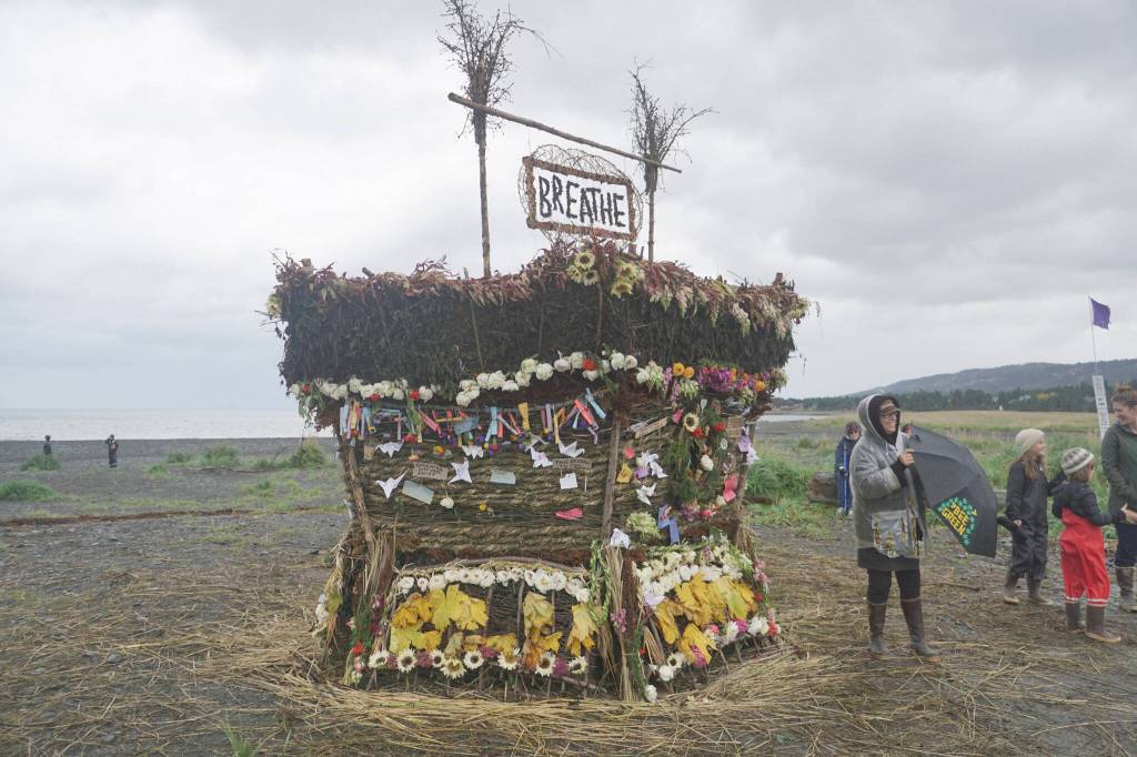 Burning Basket coordinator Mavis Muller stands in front of the 19th annual Burning Basket, Breathe, on Sunday, Sept. 11, 2022, at Mariner Park on the Homer Spit in Homer, Alaska. (Photo by Michael Armstrong/Homer News)