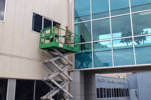 A worker with Lakeshore Glass installs new windows in one of the South Peninsula Hospital labor and delivery rooms to create a negative-pressure environment for COVID-19 infected patients. "To date, the negative pressure rooms were only in Acute Care and ER, and any deliveries by a Covid positive mother happened in a negative pressure room in the inpatient section of the hospital," SPH Public Information Officer Derotha Ferraro said. (Photo by Derotha Ferrator/South Peninsula Hospital.)