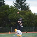 Mariner quarterback Carter Tennison drills the ball to Morgan Techie on a successful run by Techie to score Homers first touchdown at homecoming on Friday, Sept. 16, 2022, in Homer, Alaska. (Photo by Michael Armstrong/Homer News)
