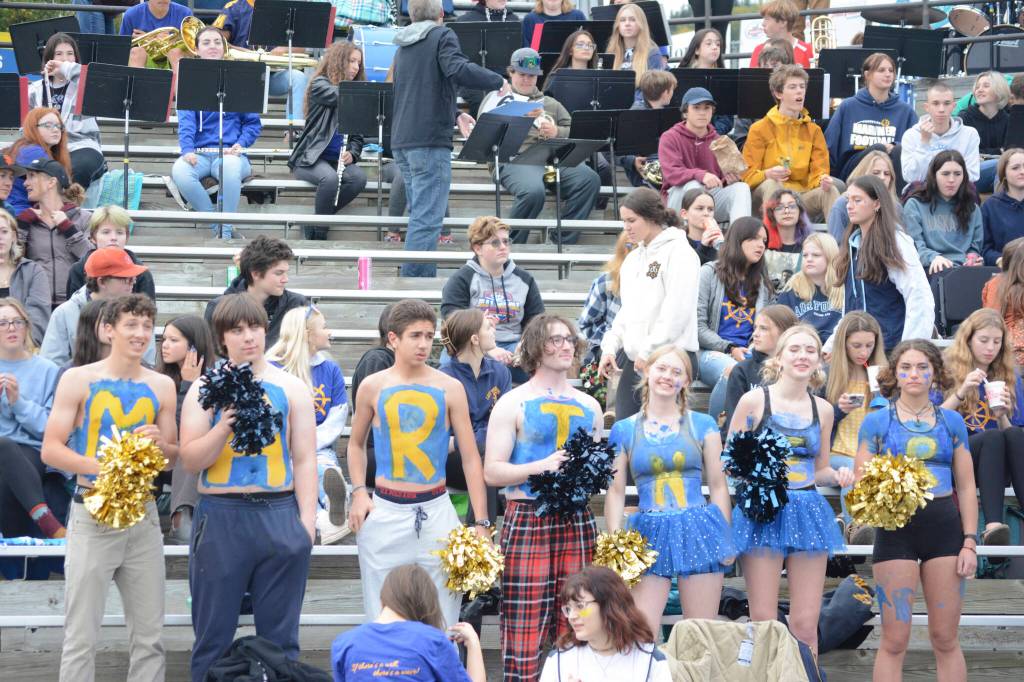 A group of Mariners cheer for their team at the homecoming football game against the Barrow Whalers on Friday, Sept. 16, 2022, at Homer High School in Homer, Alaska. (Photo by Michael Armstrong/Homer News)