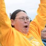 Stella Scott cheers as the Barrow Whalers of Utqiagvik make a touchdown on Friday, Sept. 16, 2022, at the Mariners vs. Whalers football game at Homer High School in Homer, Alaska. Scott lives in Homer, but her home town is Utqiagvik and she came to support the team with visiting residents from the farthest north Alaska city. (Photo by Michael Armstrong/Homer News)
