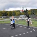 Kids play basketball at the Kachemak City Park Grand Opening on Saturday, Sept. 17, 2022. (Photo by Charlie Menke / Homer News)