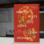A copy of "Nobody Gets Out Alive" stands on a desk inside The Peninsula Clarion's offices on Tuesday, Aug. 30, 2022 in Kenai, Alaska. (Ashlyn O'Hara/Peninsula Clarion)