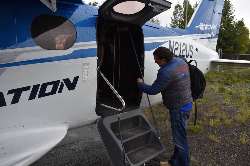 Joel Caldwell shows off the new Tecnam Traveller on Thursday, Sept. 15, 2022, in Kenai, Alaska. (Jake Dye/Peninsula Clarion)
