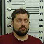 A police mugshot of Kirby Calderwood, 32, of Ogden, Utah, the man charged in the murder and kidnapping of Anesha "Duffy" Murnane. (Photo provided/Homer Police)