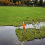 Water pools in a track and field long jump sandpit at Nikiski Middle/High School on Monday, Sept. 19, 2022, in Nikiski, Alaska. The track is one of several projects in a bond package Kenai Peninsula voters will consider during the Oct. 4 municipal election next month. (Ashlyn OHara/Peninsula Clarion)
