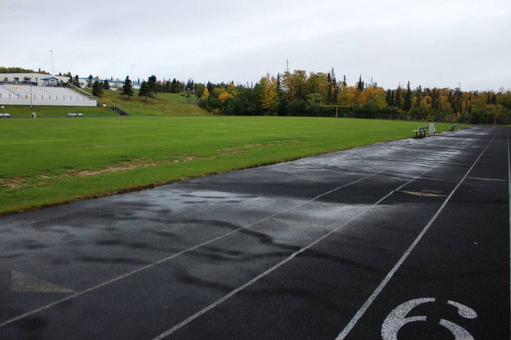 Water pools on a warped track at Nikiski Middle/High School on Monday, Sept. 19, 2022, in Nikiski, Alaska. The track is one of several projects in a bond package Kenai Peninsula voters will consider during the Oct. 4 municipal election next month. (Ashlyn OHara/Peninsula Clarion)