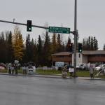 Sign wavers line the corner of the Kenai Spur Highway and Bridge Access Road on Election Day, Oct. 4, 2022 in Kenai, Alaska. (Jake Dye/Peninsula Clarion)