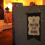 A sign welcoming visitors to the Literary Haunted House at the Kenai Community Library can be seen here on Oct. 30, 2019. (Photo by Brian Mazurek/Peninsula Clarion)