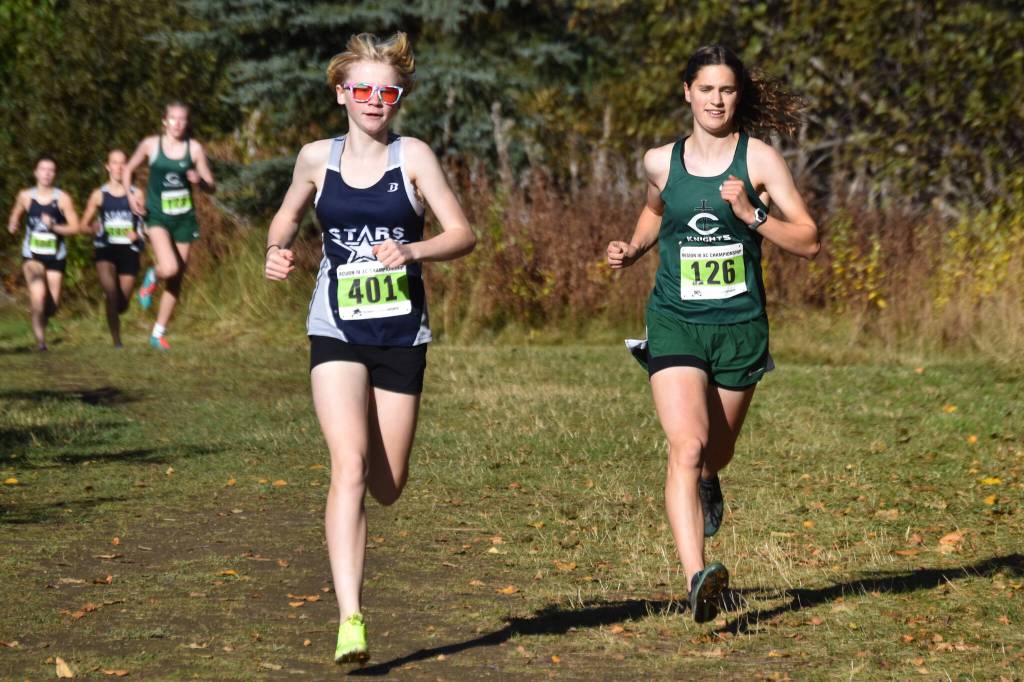 Soldotnas Sophia Jedlicki and Colonys Ella Hopkins race side by side during the Region 3/Division I girls race on Saturday, Oct. 1, 2022 at Tsalteshi Trails just outside of Soldotna, Alaska. (Jake Dye/Peninsula Clarion)