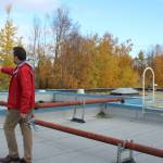 Soldotna Elementary School Principal Dr. Austin Stevenson walks amid natural gas pipes anchored to the outside of school on Friday, Sept. 30, 2022, in Soldotna, Alaska. (Ashlyn OHara/Peninsula Clarion)