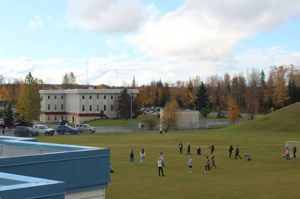 Soldotna Elementary School students play soccer on Friday, Sept. 30, 2022, in Soldotna, Alaska. The Kenai Peninsula Borough School District offices overlook the field. (Ashlyn OHara/Peninsula Clarion)