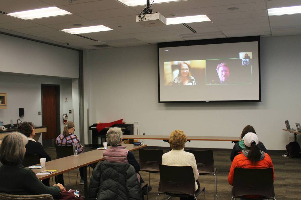 Candidates for Alaska State House District 6 Ginger Bryant, on screen, left, and Louie Flora, on screen, right, participate remotely in a forum held at the Soldotna Public Library on Monday, Oct. 24, 2022 in Soldotna, Alaska. (Ashlyn OHara/Peninsula Clarion)