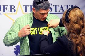 Chris Bye, a Libertarian wearing a Got Liberty T-shirt under button down shirt, is shown getting ready for a debate for Alaskas sole U.S. House seat Wednesday, Oct. 26, 2022, in Anchorage, Alaska. Bye faces U.S. Rep. Mary Peltola, a Democrat, and Republicans Sarah Palin and Nick Begich in the November general election. (AP Photo/Mark Thiessen)
