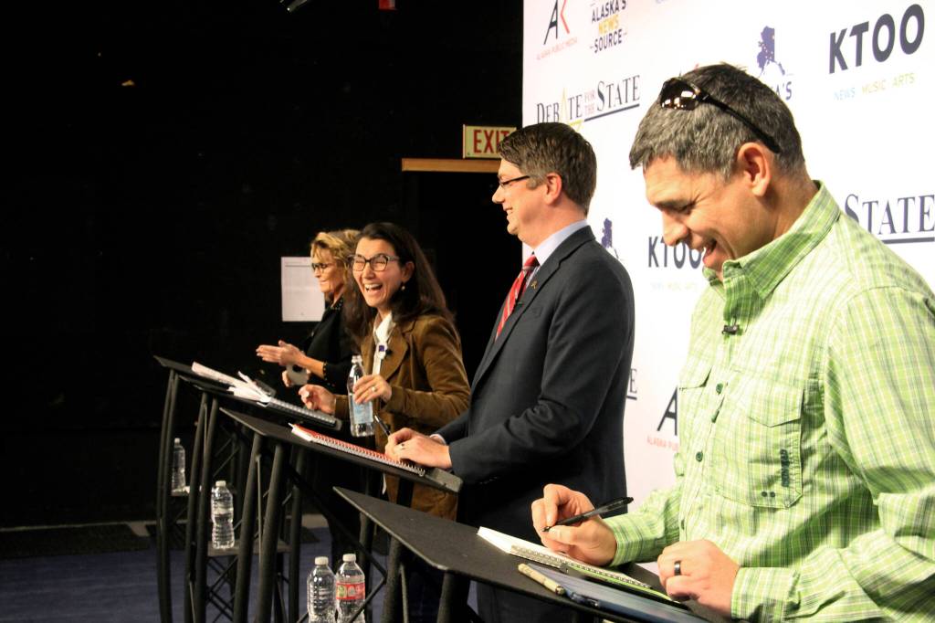 Candidates for Alaskas sole U.S. House seat share a laugh before a debate Wednesday, Oct. 26, 2022, in Anchorage, Alaska. From left are Republican Sarah Palin, U.S. Rep. Mary Peltola, a Democrat; Republican Nick Begich, and Chris Bye, a Libertarian. (AP Photo/Mark Thiessen)