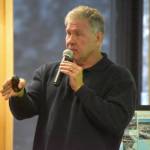 Patrick Simpson speaks about his recycled plastic lumber project at a Kenai Peninsula College Showcase on Thursday, Oct. 27, 2022, in Soldotna, Alaska. (Jake Dye/Peninsula Clarion)