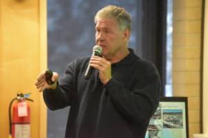 Patrick Simpson speaks about his recycled plastic lumber project at a Kenai Peninsula College Showcase on Thursday, Oct. 27, 2022, in Soldotna, Alaska. (Jake Dye/Peninsula Clarion)