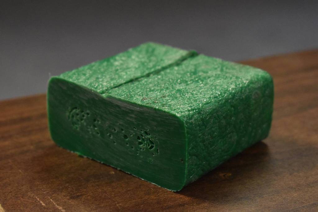 A sample of Patrick Simpsons recycled plastic lumber is photographed in the Peninsula Clarion newsroom on Friday, Oct. 28, 2022, in Kenai, Alaska. (Jake Dye/Peninsula Clarion)