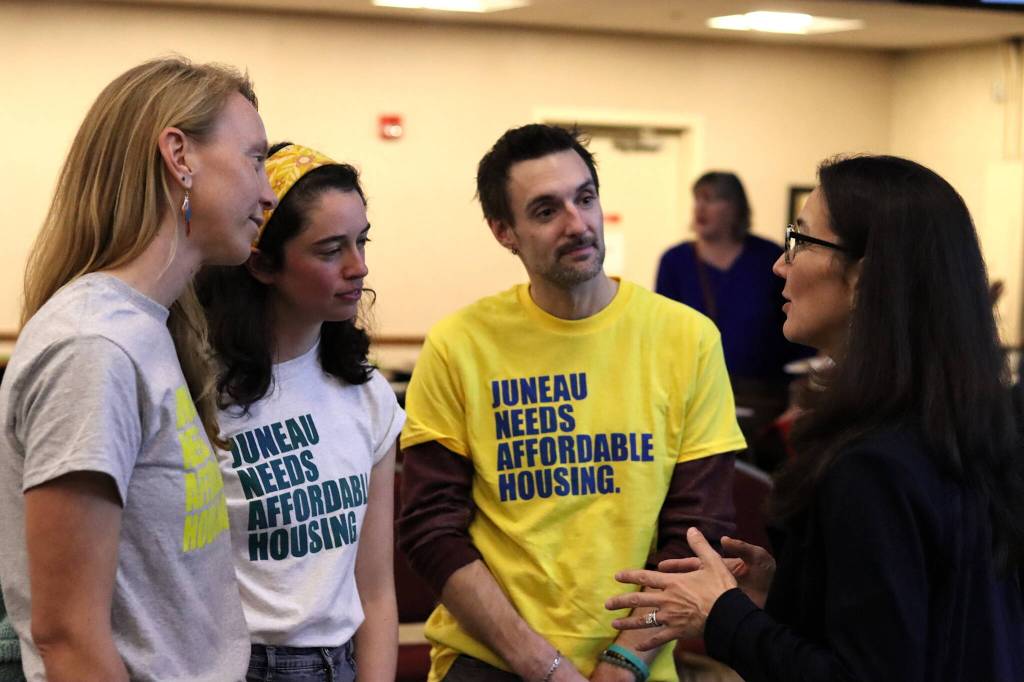 Staff from The Glory Hall including (from left to right) Program Manager Teal Goodfell, Interim Executive Director Chloe Papier and Deputy Director Luke Broman discuss homeless and housing issues with U.S. Rep. Mary Peltola during a campaign event Monday at Elizabeth Peratrovich Hall. (Mark Sabbatini / Juneau Empire)