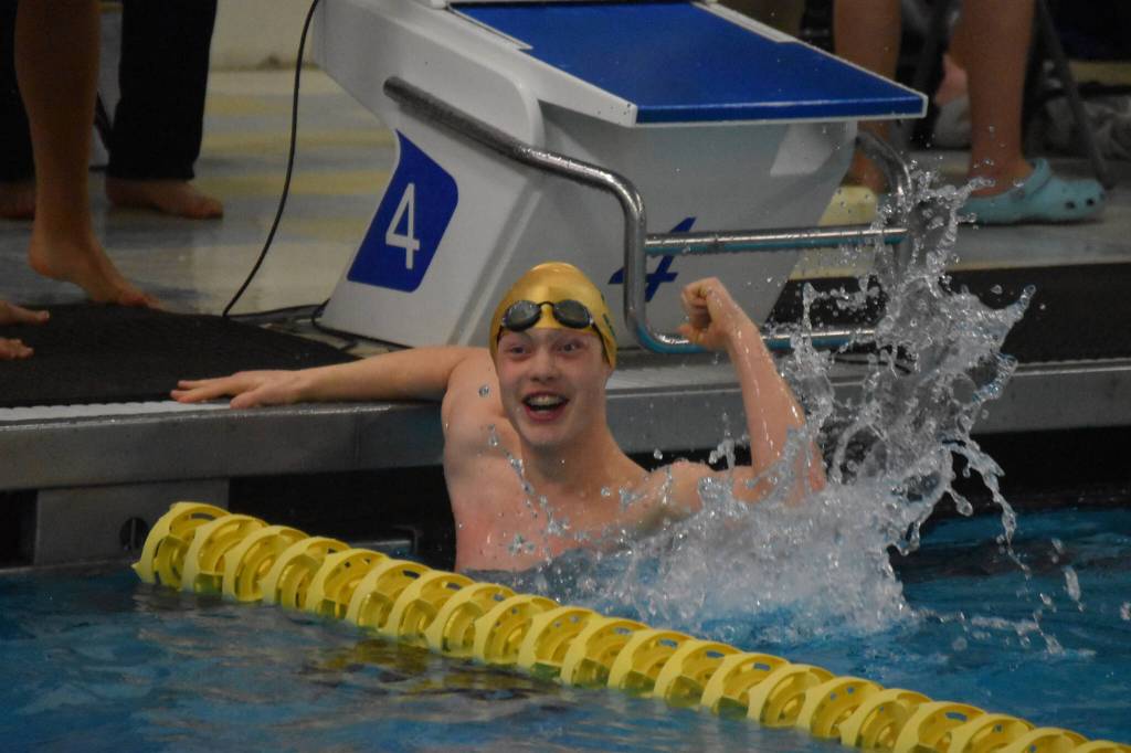 Sewards Paxton Hill celebrates after the 200-yard freestyle relay during finals at the ASAA State Swim & Dive Championships on Saturday, Nov. 5, 2022, at Bartlett High School in Anchorage, Alaska. Seward won the relay, the first relay title claimed by the school in program history. (Jake Dye/Peninsula Clarion)