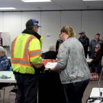 Poll worker Harmony Bolden (right) helps a voter cast their ballot at the Soldotna Regional Sports Complex on Tuesday, Nov. 8, 2022 in Soldotna, Alaska. (Ashlyn O'Hara/Peninsula Clarion)